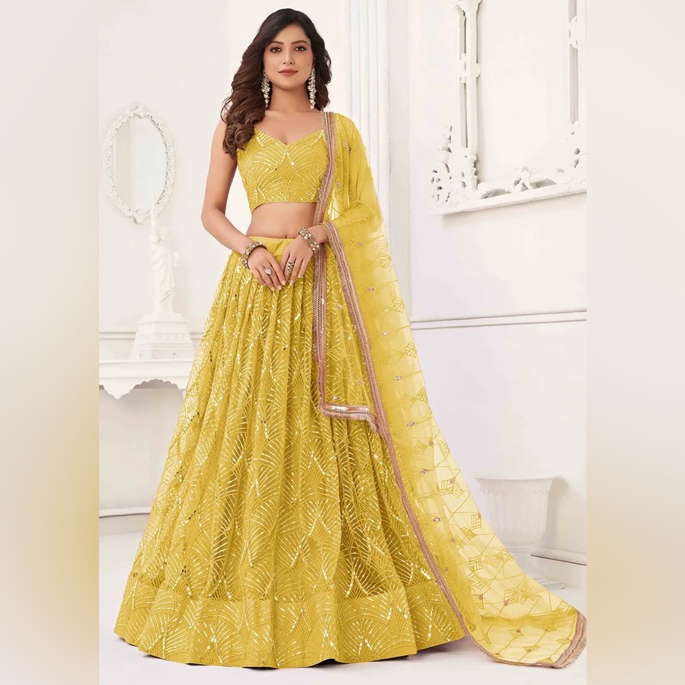 Yellow lengha with silver sequins and mirrors